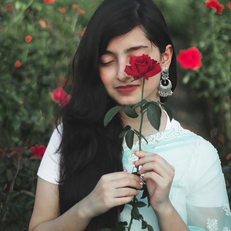 Kaveri Mehta, Lead Design Curator at CalmForwardJourney, reviewing corporate floral arrangements